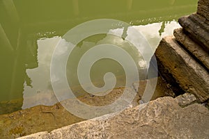 ancient Roman bath stone walls stairs column