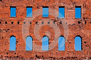 Ancient roman brick wall with blue sky.