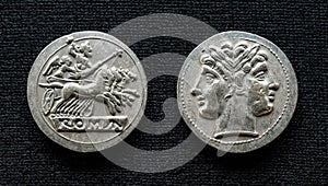 Ancient Roman coin showing Jupiter on horses and god Janus, 225-214 BC