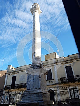 This is the ancient Roman column that marks the end of the Appian Way. It is located in the city of Brindisi, in Puglia, Italy. photo