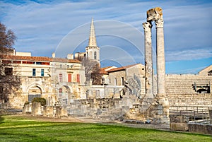 Ancient roman columns and amphitheatre in Arles photo