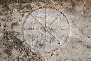 An ancient Roman game-stone carved in the floor. Didyma, Aydin, Turkey