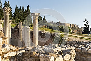 Ancient Roman pillars and Ayasuluk Castle in Selcuk city in summer season, Turkey