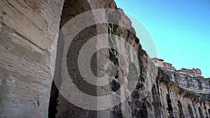 Ancient Roman ruins. Ancient amphitheater located in El Jem, Tunis. Passage along the wall. Historic Landmark..