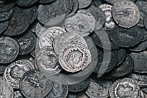 Ancient Roman silver coins on full background. Archaeological treasure (concepts, collecting, riches)