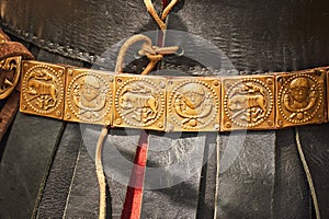 Ancient Roman vintage leather warrior clothing and decorated belt. Reconstruction of military events during the wars of the Roman