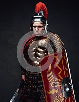 Ancient rome soldier with angry stare against dark background