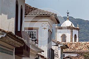 Ancient roofs with an old church tower in the background