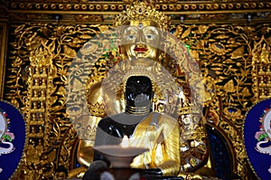 Ancient ruin buddha in antique old ubosot of Wat Ming Mueang temple for thai people traveler travel visit and respect praying