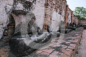 Ancient ruin of sitting buddha statue at old royal temple.