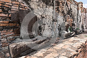 Ancient ruin of sitting buddha statue at old royal temple.