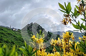 Ancient ruined castle Kale-i Bala and spring mountain valley