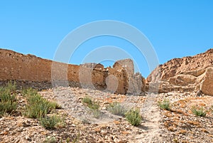 An ancient ruined stone wall in desert