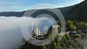 Ancient Ruins, Aerial Drone Shot in autumn of Traben-Trarbach City with Morning Fog. River Moselle, Germany. Moselland.