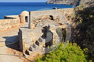 Ancient ruins of a fortified leper colony. Spinalonga island, Crete, Greece