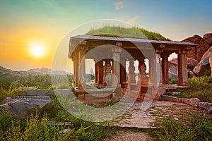 Ancient ruins in Hampi on sunset. India