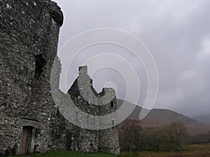 Ancient ruins of the Kilchurn Castle in a gloomy weather