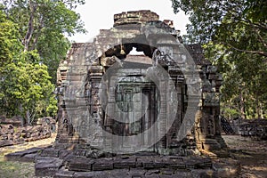 Ancient ruins of Krol Ko temple in Angkor Wat complex, Cambodia. Small shrine with stone bas-relief.