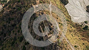 Ancient ruins of a medieval castle on top of the mountain. Amendolea Castle.