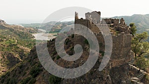 Ancient ruins of a medieval castle on top of the mountain. Amendolea Castle.