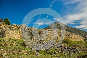 Ancient ruins of old unknown city in picturesque colorful highland exotic valley on lonely mountain background