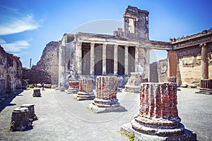 Ancient ruins in Pompeii - Colonnade in courtyard of Domus Pompei in Via della Abbondanza, Naples, Italy photo