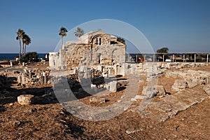 Ancient ruins at the sea with palms