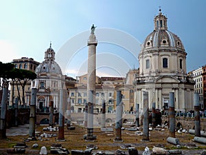 Ancient ruins of the Trajan`s forum in Rome, Italy. Imperial forum traiani and Santa Maria di Loreto Church. Ancient roman ruins