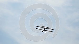 Ancient Russian aircraft biplane An2 flying in the blue sky