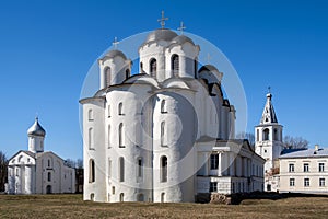 Ancient Russian church on the Yaroslav`s Courtyard. St Nicholas cathedral domes, Paraskeva Pyatnitsa church and Gate tower. Velik