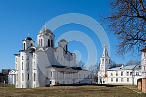 Ancient Russian church on the Yaroslav`s Courtyard. St Nicholas cathedral domes, Paraskeva Pyatnitsa church and Gate tower. Velik