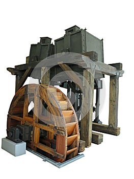 Ancient rusty old wooden water wheel driven machine isolated over white
