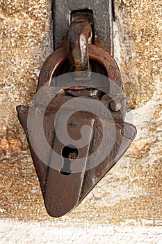 Ancient rusty padlock with a keyhole