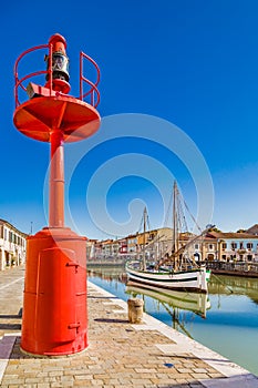 ancient sailboats and lamp on Italian Canal Port