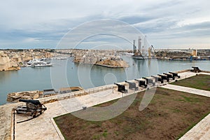Ancient Saluting Battery monument with a row of cannons near Upper Barrakka Gardens in Valletta