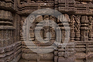 Ancient sandstone carvings on the walls of the ancient 13th century sun temple at Konark, Odisha, India.