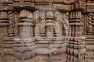 Ancient sandstone carvings on the walls of the ancient 13th century sun temple at Konark, Odisha, India.