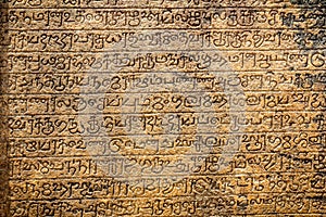 Ancient sanskrit on sandstone tablet