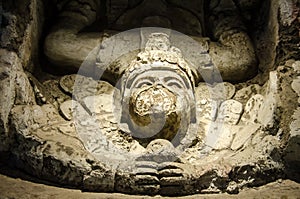 Ancient sculpture of the falling god of the Mayas at Tulum photo