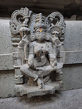 Ancient sculpture of goddess in old hindu temple