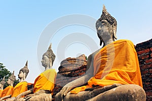 Ancient sculptures of Buddha in the old temple of Wat Yai Chaimongkol in Ayutthaya, Thailand.