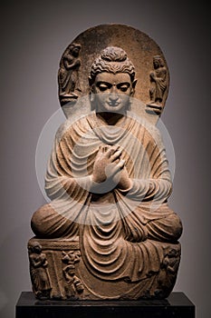 Ancient seated Buddha schist statue image in 2nd-3rd century, Kushan dynasty from Gandhara, Pakistan