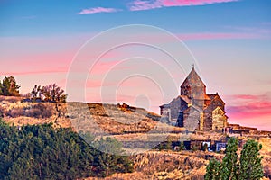 Ancient Sevanavank monastery on Lake Sevan in Armenia during sunset