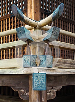 Ancient Shinto shine corner post decorations in Tokyo, Japan.