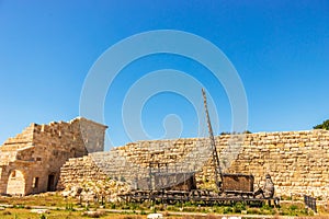 Ancient ship against walls of historic city of Patara in Turkey.