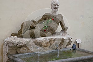 Ancient Silenus statue on via del Babuino, Rome photo