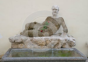 Ancient Silenus statue on via del Babuino, Rome photo