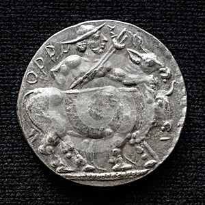 Ancient silver coin with image of bull, old rare money