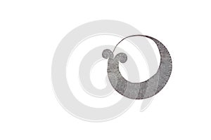 Ancient silver earring of Thai ethnic people in the north of Thailand, isolated on white background.