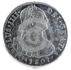 Ancient Spanish silver coin of King Carlos IV isolated on a white background